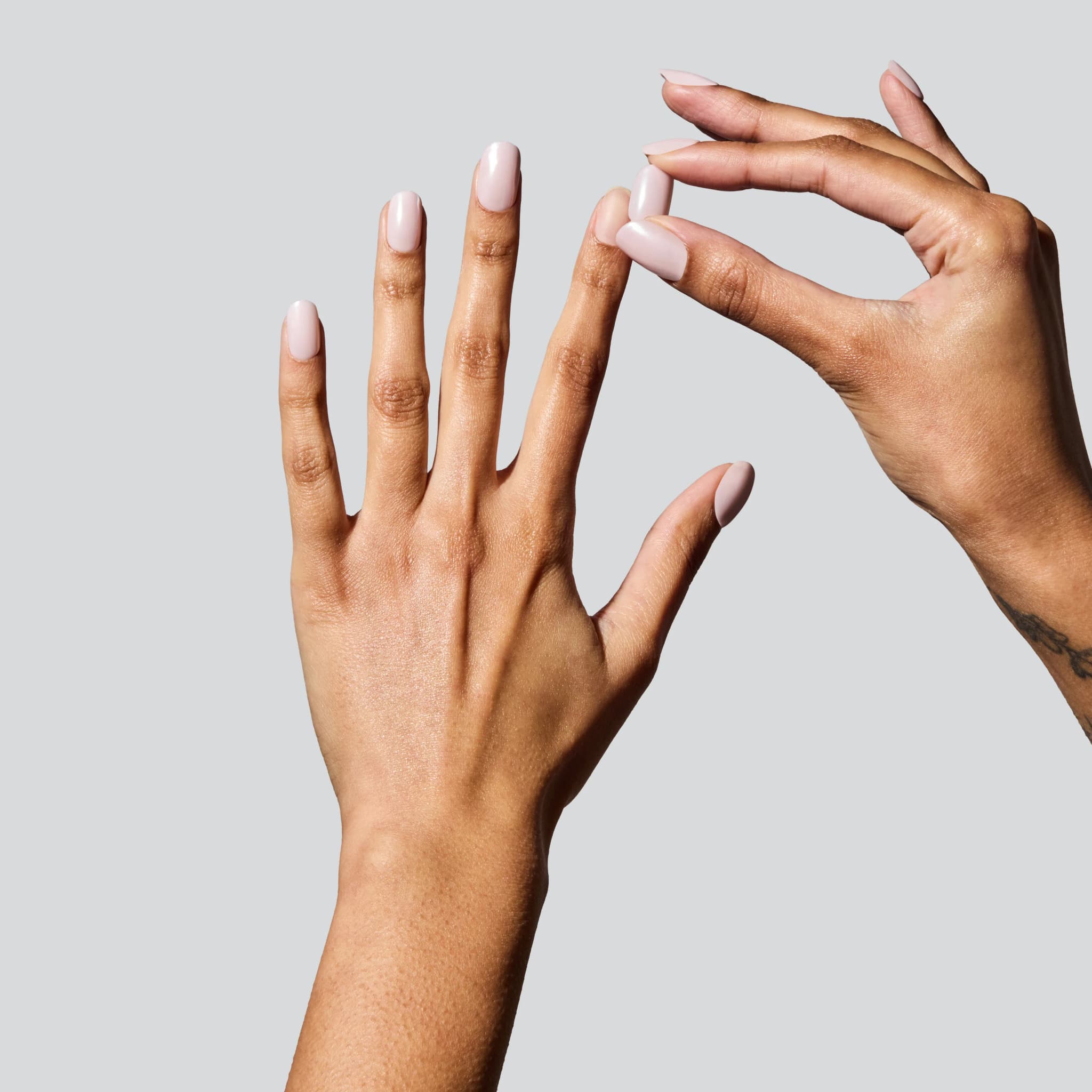 Applying Light Pink Chrome Glaize Tips press-on nails